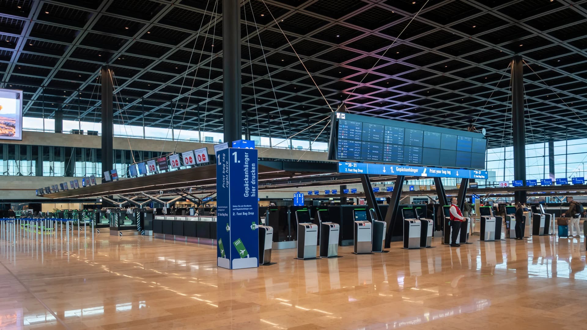 A bright, empty airport departure hall