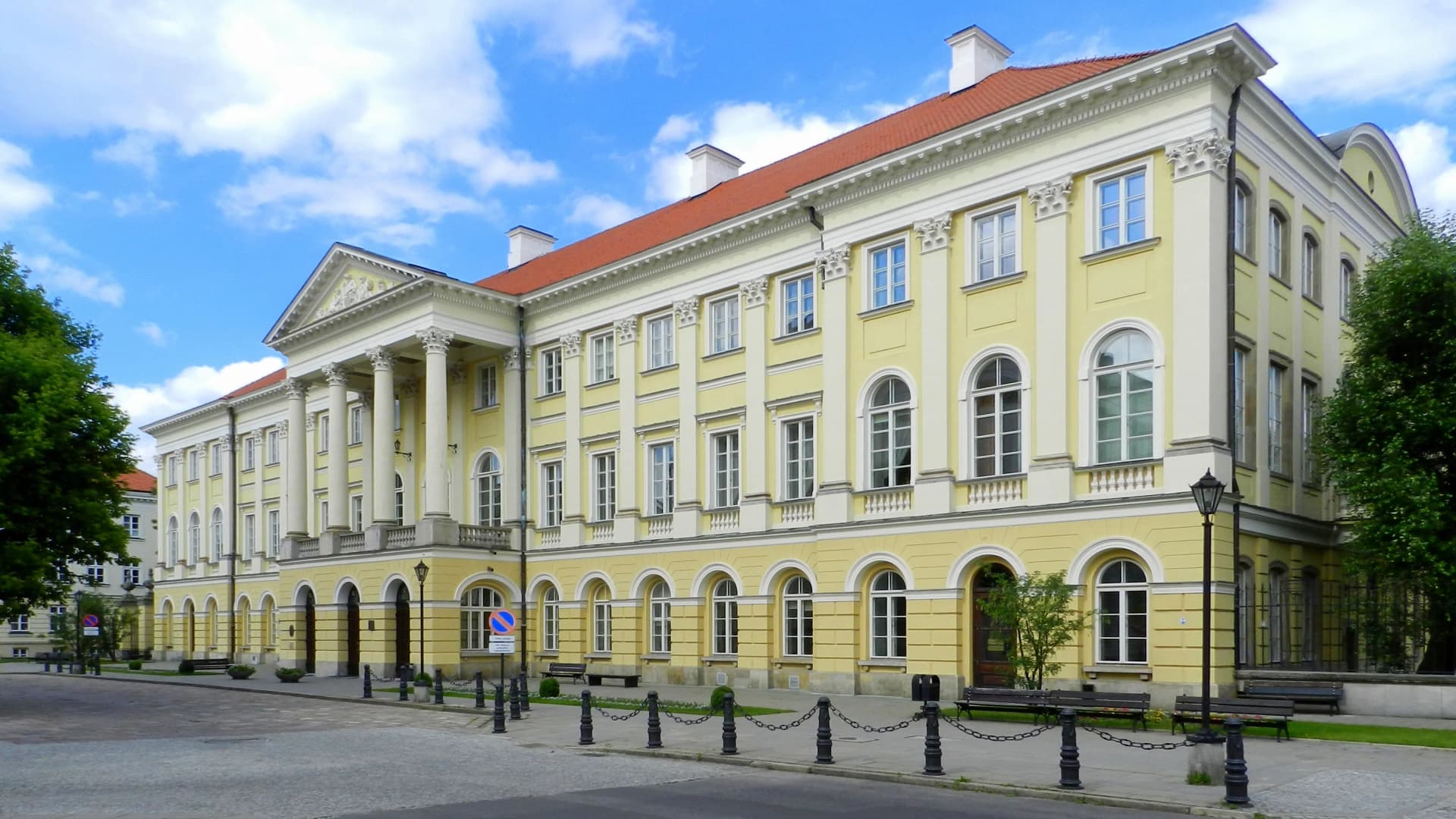 Neoclassical university building on a sunny day